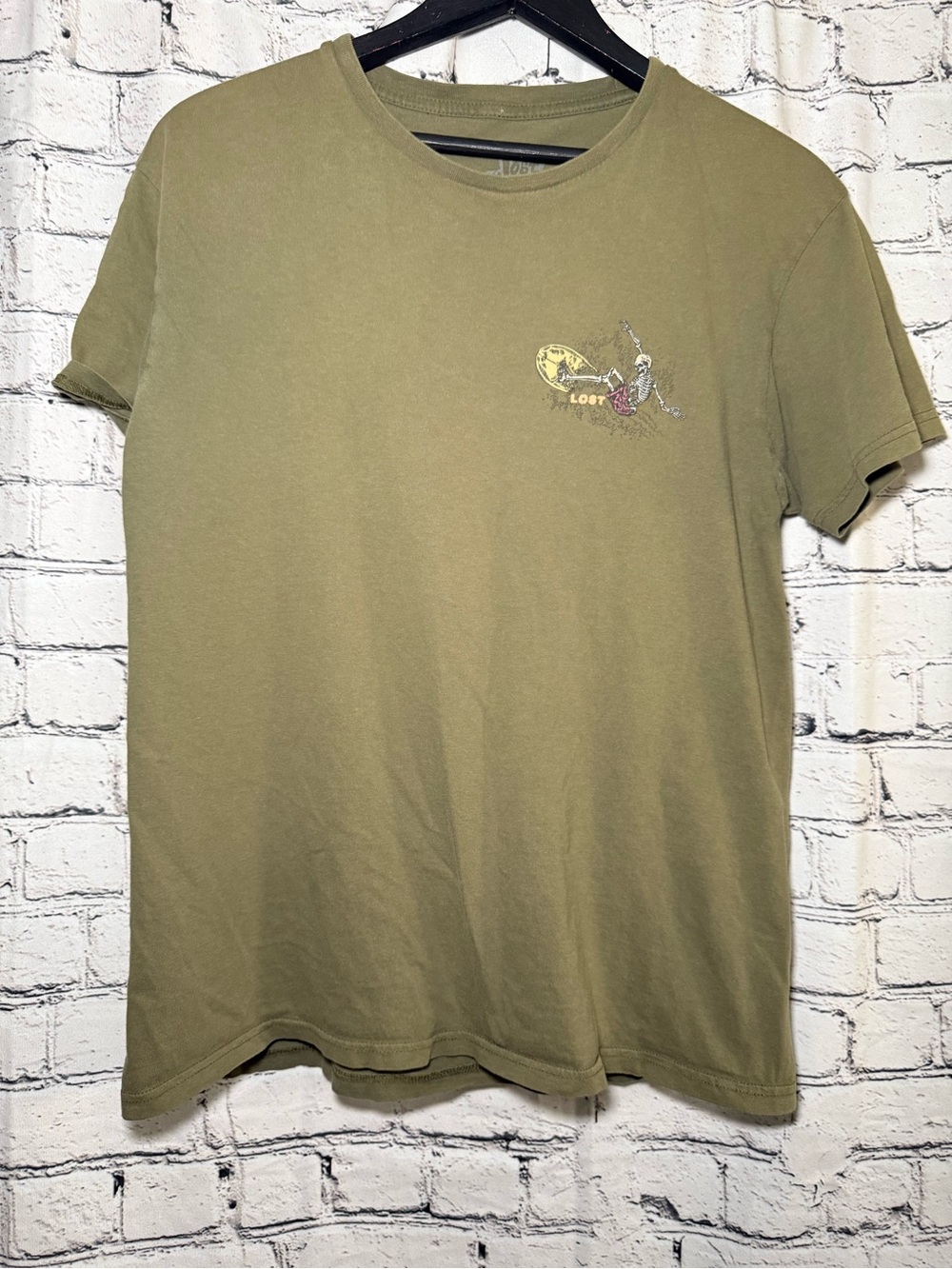 Green graphic tee. Size M